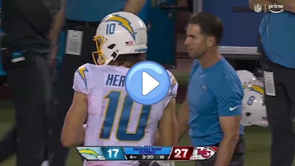 Video thumb: Justin Herbert points at his ribs and looks very uncomfortable warming up.